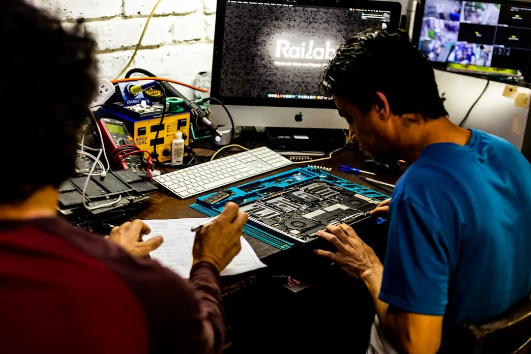 Professional computer repair technician servicing a desktop PC tower in Northampton